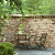 Pilestone Primavera 17/23x21,5x10 Getrommeld stapelbaar muurelement in trapeziumvorm met 2 ruwe zijden Stapelblokken